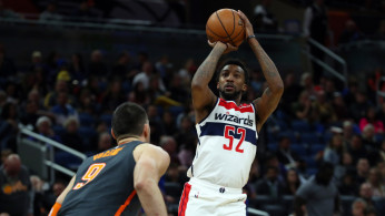 Washington Wizards guard Jordan McRae (52) shoots over Orlando Magic center Nikola Vucevic (9)
