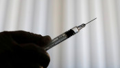 A doctor prepares a syringe as part of the start of the seasonal influenza vaccination campaign in Nice, France October 24, 2018. 