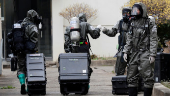 South Korean soldiers from a chemical corps prepare to carry out quarantine works at an apartment complex which is under cohort isolation after mass infection of coronavirus disease (COVID-19) reported in Daegu