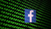 The Facebook logo and binary cyber codes are seen in this illustration taken November 26, 2019.