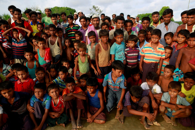 Rohingya Muslims gather together at a traditional wrestling festival at Kyaukpannu village in Maungdaw, northern Rakhine state 