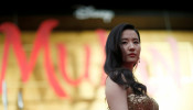 Cast member Liu Yifei poses at the premiere for the film 