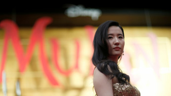 Cast member Liu Yifei poses at the premiere for the film 