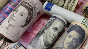 Banknotes of Euro, Hong Kong dollar, U.S. dollar, Japanese yen, GB pound and Chinese 100 yuan are seen in this picture illustration