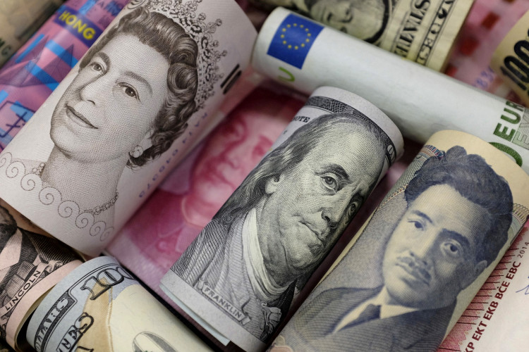 Banknotes of Euro, Hong Kong dollar, U.S. dollar, Japanese yen, GB pound and Chinese 100 yuan are seen in this picture illustration