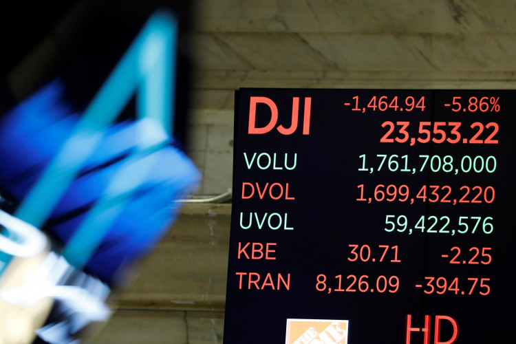 The Dow Jones Industrial Average is displayed after the closing bell on the floor of the New York Stock Exchange (NYSE)