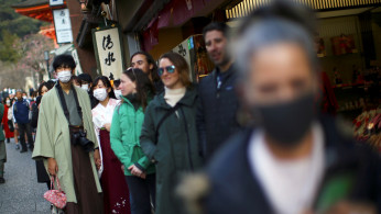 A Kimono-clad man, wearing a protective mask following an outbreak of the coronavirus disease (COVID-19)