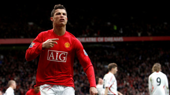 FILE PHOTO: Manchester United's Cristiano Ronaldo celebrates scoring his team's second goal in the 79th minute of their 3-0 victory over Liverpool in the Premier League