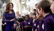 Catherine, Duchess of Cambridge, speaks with a school choir as she hosts a Gala Dinner in celebration of the 25th anniversary of Place2Be at Buckingham Palace, in London