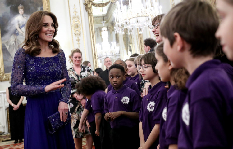 Catherine, Duchess of Cambridge, speaks with a school choir as she hosts a Gala Dinner in celebration of the 25th anniversary of Place2Be at Buckingham Palace, in London