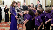 Catherine, Duchess of Cambridge, speaks with a school choir as she hosts a Gala Dinner in celebration of the 25th anniversary of Place2Be at Buckingham Palace, in London