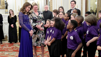Catherine, Duchess of Cambridge, speaks with a school choir as she hosts a Gala Dinner in celebration of the 25th anniversary of Place2Be at Buckingham Palace, in London