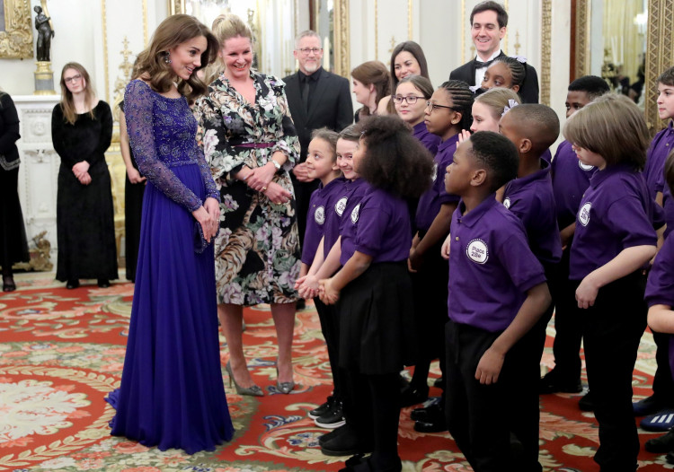 Catherine, Duchess of Cambridge, speaks with a school choir as she hosts a Gala Dinner in celebration of the 25th anniversary of Place2Be at Buckingham Palace, in London