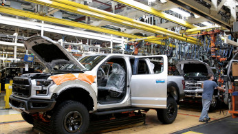 A Ford 2018 F-150 pick-up truck moves down the assembly line at Ford's Dearborn Truck Plant 