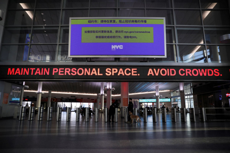 A warning sign at Whitehall Terminal warns ferry riders to practice social distancing