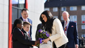 Britain's Meghan, Duchess of Sussex, arrives to visit the Robert Clack School in Essex
