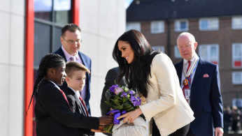 Britain's Meghan, Duchess of Sussex, arrives to visit the Robert Clack School in Essex