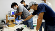Volunteers work on manufacturing ventilators for use during the coronavirus disease (COVID-19) outbreak, in Santa Cruz