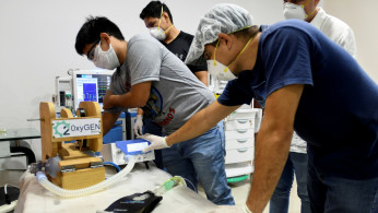 Volunteers work on manufacturing ventilators for use during the coronavirus disease (COVID-19) outbreak, in Santa Cruz