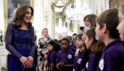 Catherine, Duchess of Cambridge, speaks with a school choir as she hosts a Gala Dinner in celebration of the 25th anniversary of Place2Be at Buckingham Palace, in London