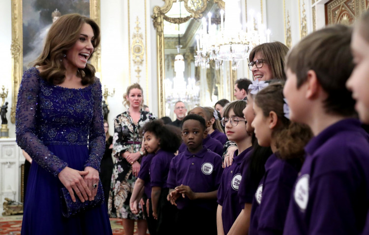 Catherine, Duchess of Cambridge, speaks with a school choir as she hosts a Gala Dinner in celebration of the 25th anniversary of Place2Be at Buckingham Palace, in London