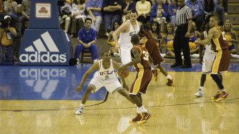 Russell Westbrook of UCLA Bruins guards O.J. Mayo of Southern California Trojans