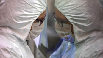 An expert from bio organic department of Polish Science Academy checks blood samples for coronavirus disease (COVID-19) in a laboratory in Poznan