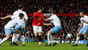 FILE PHOTO: Manchester United's Cristiano Ronaldo flicks the ball past the Aston Villa defence before scoring the opening goal in a 4-0 Premier League win at Old Trafford