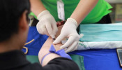 Person getting his blood checked.
