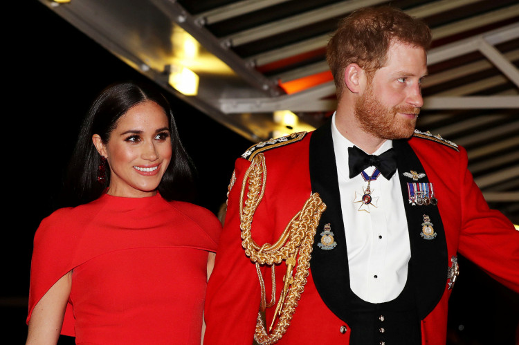 FILE PHOTO: Britain's Prince Harry and his wife Meghan, arrive to attend the Mountbatten Festival of Music at the Royal Albert Hall in London, Britain March 7, 2020. REUTERS/Simon Dawson/Pool -/File Photo