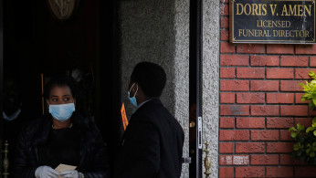 Guests exit a funeral for a family member at Jurek-Park Slope Funeral Home during the outbreak of the coronavirus disease (COVID19) in the Brooklyn