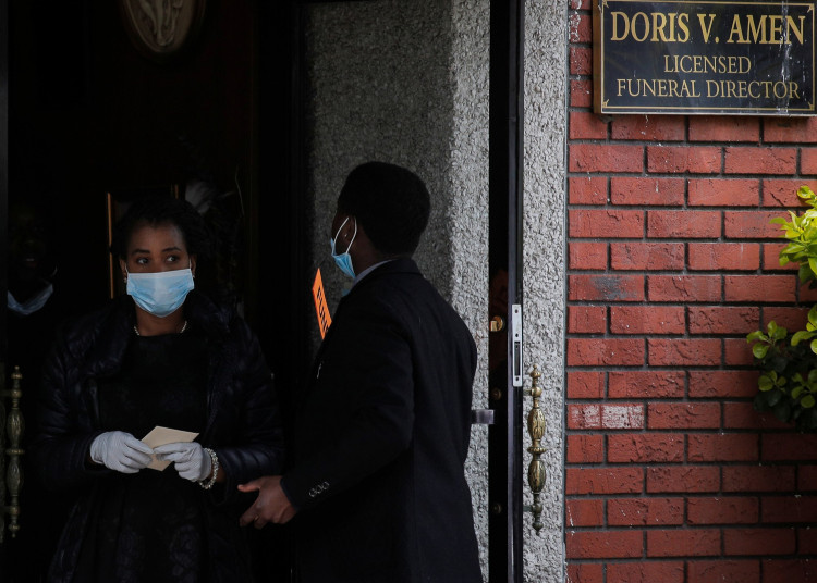 Guests exit a funeral for a family member at Jurek-Park Slope Funeral Home during the outbreak of the coronavirus disease (COVID19) in the Brooklyn