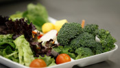 Some of more than 8,000lbs of locally grown broccoli from a partnership between Farm to School and Healthy School Meals is served in a salad to students at Marston Middle School in San Diego, California, March 7, 2011.