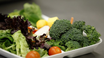 Some of more than 8,000lbs of locally grown broccoli from a partnership between Farm to School and Healthy School Meals is served in a salad to students at Marston Middle School in San Diego, California, March 7, 2011.