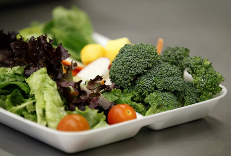 Some of more than 8,000lbs of locally grown broccoli from a partnership between Farm to School and Healthy School Meals is served in a salad to students at Marston Middle School in San Diego, California, March 7, 2011.