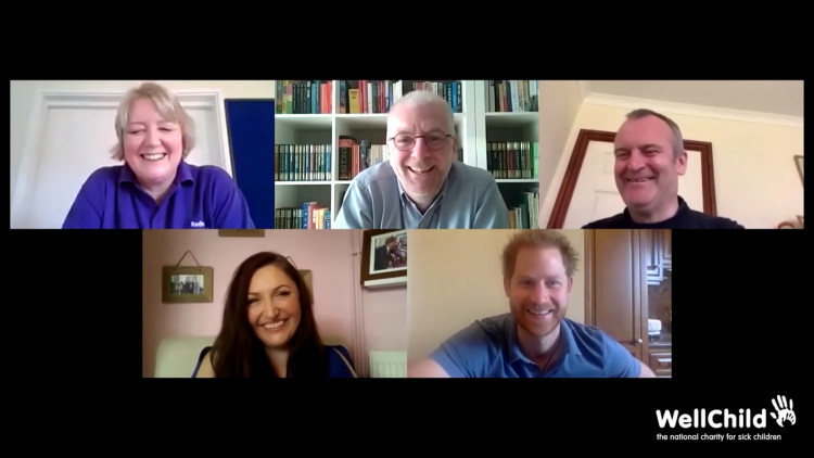 Britain's Prince Harry, Duke of Sussex conducts a video call with parents caring for seriously ill children