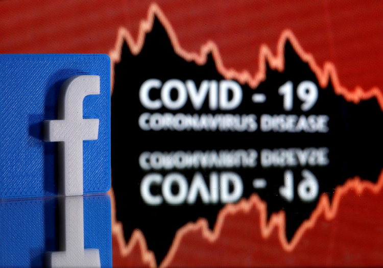 A 3D printed Facebook logo is seen in front of displayed coronavirus disease (COVID-19) words in this illustration