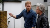 FILE PHOTO: Britain's Prince Harry meets Jon Bon Jovi and members of the Invictus Games Choir in London