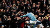 Manchester City forward Carlos Tevez celebrates with the fans