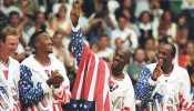 FILE PHOTO: U.S. basketball player Jordan flashes a victory sign as he stands with team mates Larry Bird, Scottie Pippen and Clyde Drexler after winning the Olympic gold in Barcelona