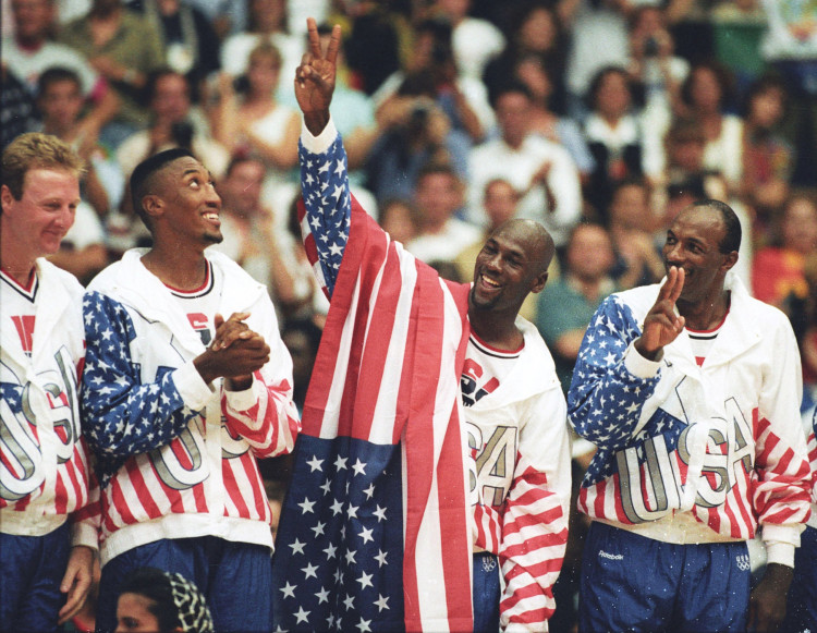 FILE PHOTO: U.S. basketball player Jordan flashes a victory sign as he stands with team mates Larry Bird, Scottie Pippen and Clyde Drexler after winning the Olympic gold in Barcelona