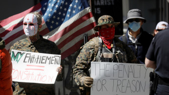 Demonstrators protest against lockdown measures in the wake of the coronavirus disease (COVID-19) outbreak during a demonstration calling for the reopening of the state of Virginia