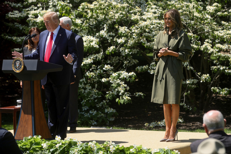 U.S. President Donald Trump and first lady Melania Trump hold a tree-planting ceremony outside the Oval Office on the 50th anniversary of Earth Day at the White House in Washington, U.S. April 22, 2020. REUTERS/Jonathan Ernst