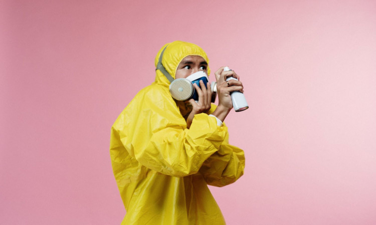 Person in yellow protective suit.