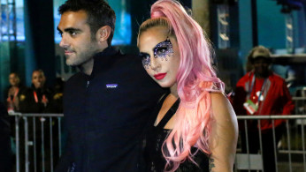 FILE PHOTO: Lady Gaga leaves Hard Rock Stadium in Miami Gardens, Florida after the NFL Super Bowl game between the Kansas City Chiefs and San Francisco 49ers, February 2, 2020. REUTERS/Marco Bello/File Photo