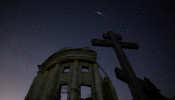 Stars are seen in the night sky during the Lyrid Meteor Shower over the ruins of Saint Trinity church in Leningrad Region
