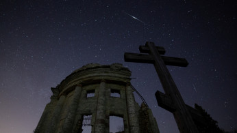 Stars are seen in the night sky during the Lyrid Meteor Shower over the ruins of Saint Trinity church in Leningrad Region