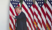 U.S. President Donald Trump points at someone in the crowd as he departs White House National Day of Prayer Service in Rose Garden of White House in Washington