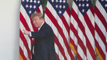 U.S. President Donald Trump points at someone in the crowd as he departs White House National Day of Prayer Service in Rose Garden of White House in Washington