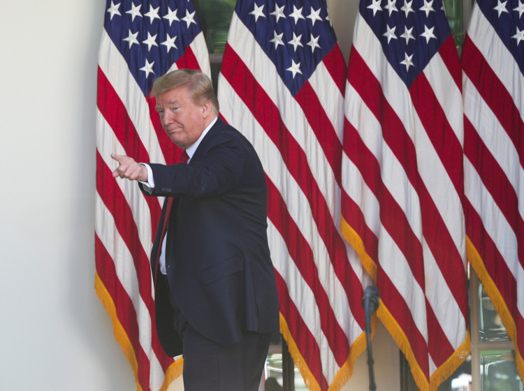U.S. President Donald Trump points at someone in the crowd as he departs White House National Day of Prayer Service in Rose Garden of White House in Washington
